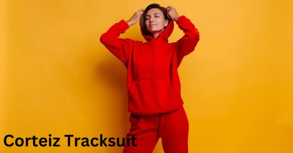a person in a red tracksuit corteiz tracksuit